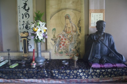 ...and contemplates the Buddha....