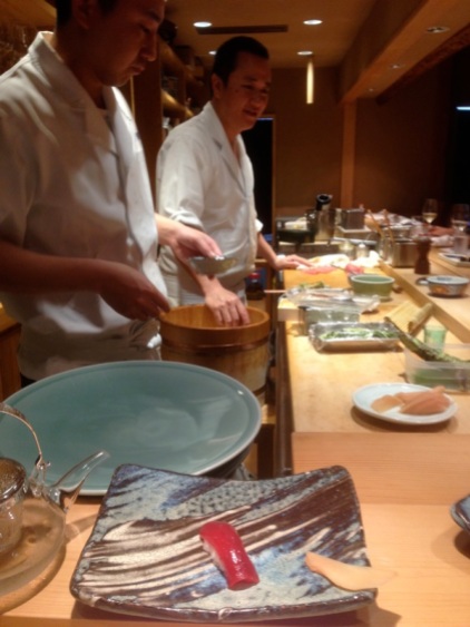 Shimazaki Daisuke, the restaurant owner, forming rice. Look at the tuna sashimi. It looks like sugar candy.